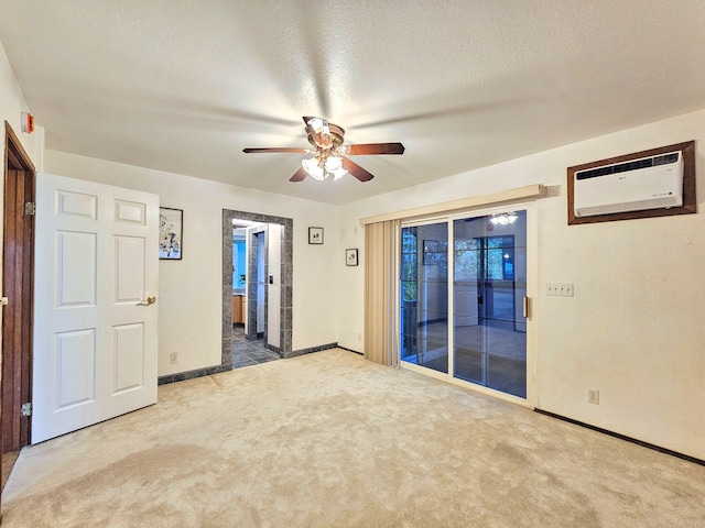 726-A Waianuenue Ave, Hilo, HI 96720 - unfurnished room with a wall mounted air conditioner, carpet, ceiling fan, and baseboards