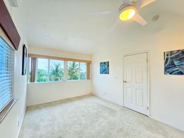 726-A Waianuenue Ave, Hilo, HI 96720 - unfurnished room featuring carpet floors, vaulted ceiling, a ceiling fan, and baseboards