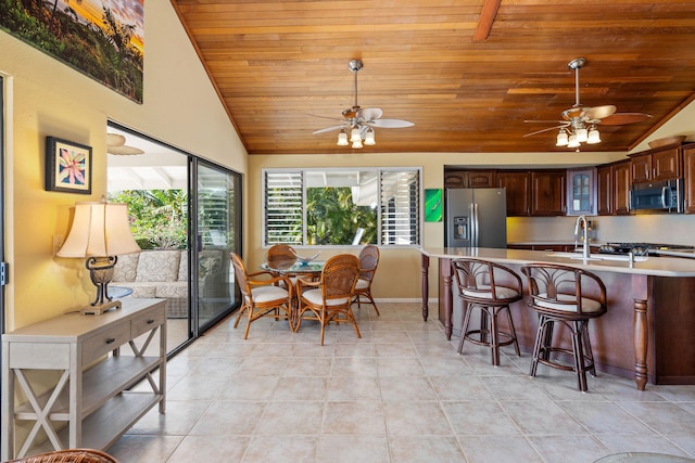 76-247 Keakealani Dr, Kailua-Kona, HI 96740 - dining room featuring wooden ceiling, vaulted ceiling, a ceiling fan, plenty of natural light, and light tile patterned floors