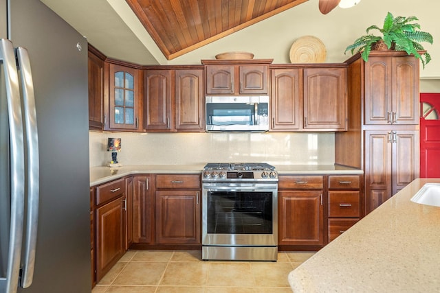 76-247 Keakealani Dr, Kailua-Kona, HI 96740 - kitchen featuring stainless steel appliances, wood ceiling, lofted ceiling, light tile patterned floors, and glass insert cabinets