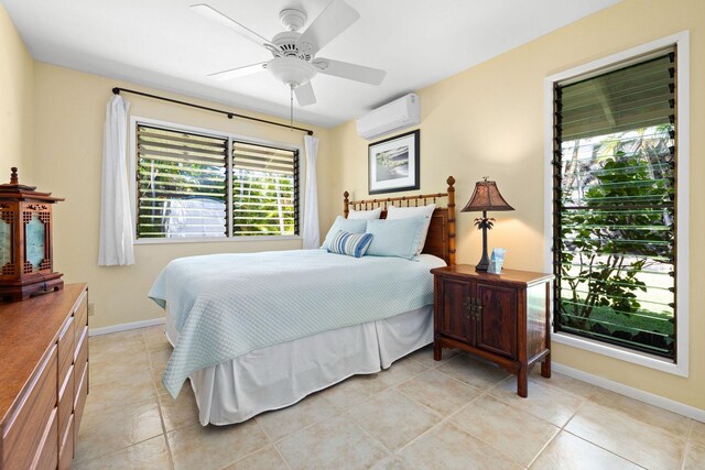 76-247 Keakealani Dr, Kailua-Kona, HI 96740 - bedroom with a wall mounted air conditioner, light tile patterned floors, baseboards, and a ceiling fan