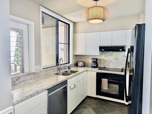 1677 Pee Rd Unit B2, Koloa, HI 96756 - kitchen with black appliances, a sink, white cabinetry, under cabinet range hood, and decorative light fixtures