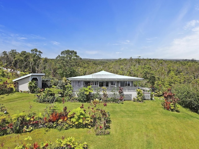 34-1480 Honomainoa Rd, Papaaloa, HI 96780 - view of front of home with a forest view, a front lawn, and a deck