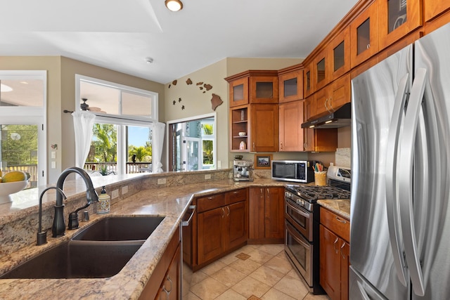 15-1932 2nd Ave, Keaau, HI 96749 - kitchen featuring stainless steel appliances, a sink, brown cabinets, and under cabinet range hood