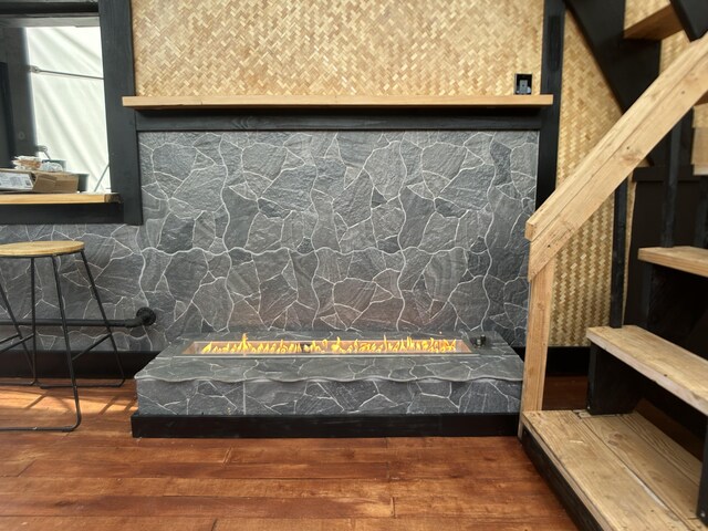 16-1896 Uhini Ana Rd, Mountain View, HI 96760 - detailed view of an outdoor fire pit and wood finished floors
