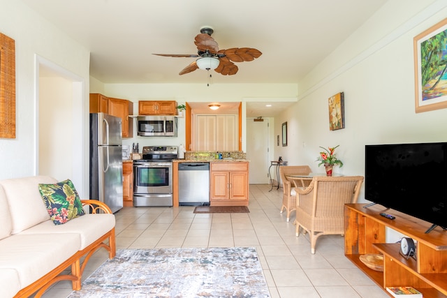 400 Hualani St Unit 2207, Hilo, HI 96720 - kitchen featuring stainless steel appliances, ceiling fan, light tile patterned flooring, and light countertops