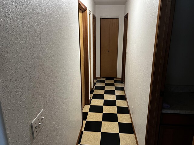 15-594 Puni Mauka Loop, Pahoa, HI 96778 - corridor featuring a textured wall and tile patterned floors
