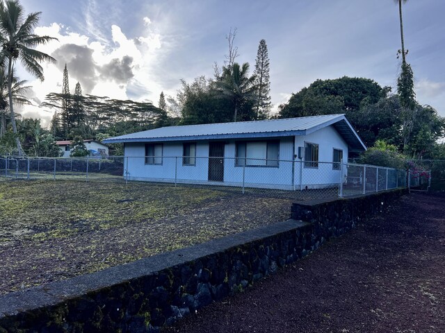 15-594 Puni Mauka Loop, Pahoa, HI 96778 - view of front of home with metal roof