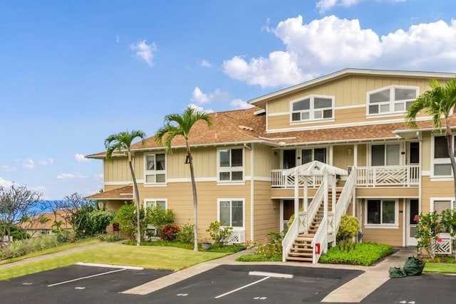 75-6060 Kuakini Hwy Unit D23, Kailua-Kona, HI 96740 - view of building exterior with uncovered parking and stairs