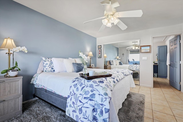 77-6585 Seaview Cir Unit 303, Kailua-Kona, HI 96740 - bedroom with light tile patterned floors, a ceiling fan, and baseboards