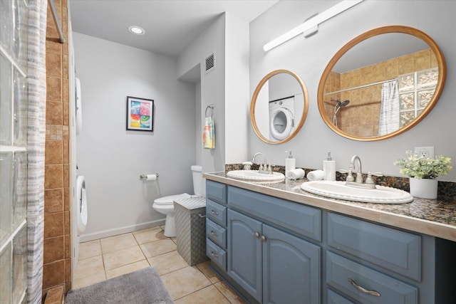 77-6585 Seaview Cir Unit 303, Kailua-Kona, HI 96740 - full bathroom featuring a tile shower, double vanity, tile patterned flooring, toilet, and baseboards
