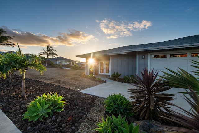 68-3635 Haena St, Waikoloa, HI 96738 - yard at dusk with french doors and a garage