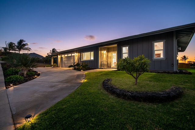 68-3635 Haena St, Waikoloa, HI 96738 - ranch-style home featuring board and batten siding, a garage, concrete driveway, and a lawn