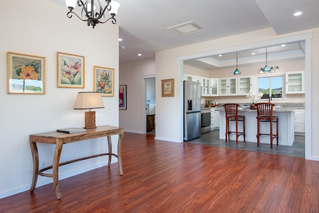 68-3635 Haena St, Waikoloa, HI 96738 - kitchen with stainless steel appliances, glass insert cabinets, a breakfast bar, recessed lighting, and dark wood-style floors
