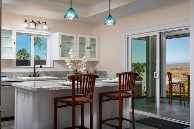 68-3635 Haena St, Waikoloa, HI 96738 - kitchen featuring a sink, dishwasher, white cabinetry, a kitchen breakfast bar, and glass insert cabinets