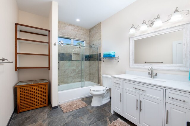 68-3635 Haena St, Waikoloa, HI 96738 - full bathroom featuring toilet, vanity, combined bath / shower with glass door, and stone finish flooring