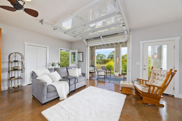 15-2000 5th Ave, Keaau, HI 96749 - living room featuring concrete floors, plenty of natural light, and ceiling fan