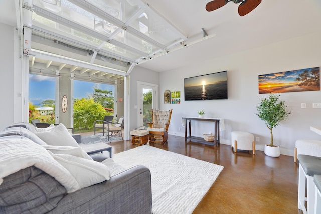 15-2000 5th Ave, Keaau, HI 96749 - living area featuring finished concrete flooring, a ceiling fan, and baseboards