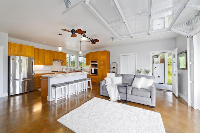 15-2000 5th Ave, Keaau, HI 96749 - living room with concrete floors and ceiling fan