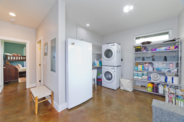 15-2000 5th Ave, Keaau, HI 96749 - laundry area with estacked washer and dryer, baseboards, recessed lighting, and electric panel
