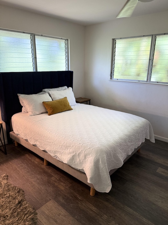 4194 Kekuanaoa Ln, Princeville, HI 96722 - bedroom featuring multiple windows and wood finished floors