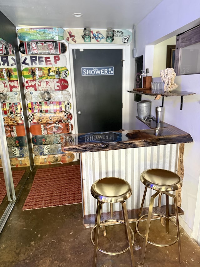 4194 Kekuanaoa Ln, Princeville, HI 96722 - indoor wet bar with concrete floors