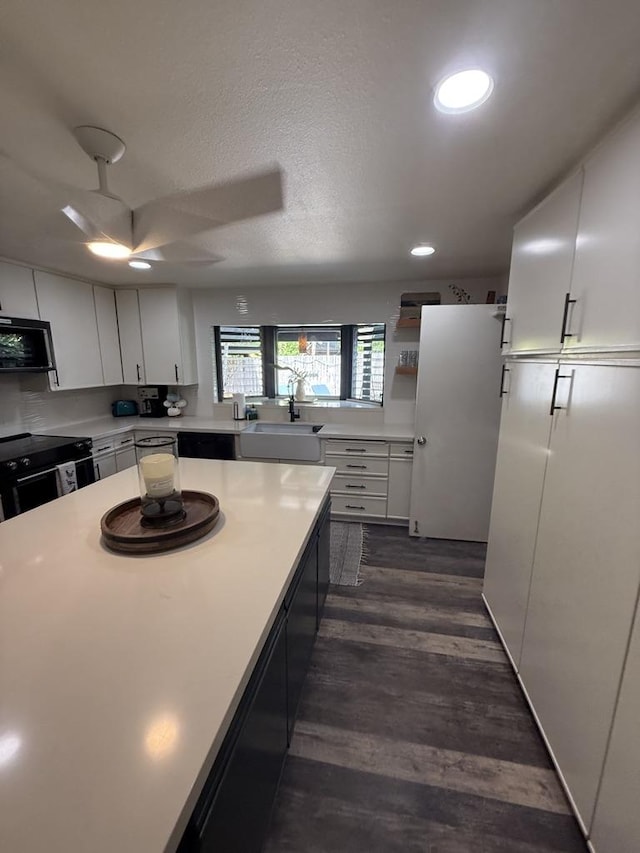 4194 Kekuanaoa Ln, Princeville, HI 96722 - kitchen featuring a sink, electric range, ceiling fan, light countertops, and recessed lighting