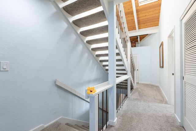 78-261 Manukai St Unit 2105, Kailua-Kona, HI 96740 - stairway with carpet flooring, wood ceiling with exposed beams, and baseboards