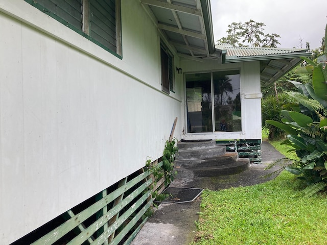 13-3515 Pahoa Kalapana Rd, Pahoa, HI 96778 - view of property exterior with entry steps and metal roof