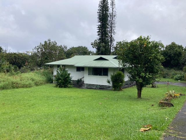 13-3515 Pahoa Kalapana Rd, Pahoa, HI 96778 - view of front of house featuring a front lawn and metal roof