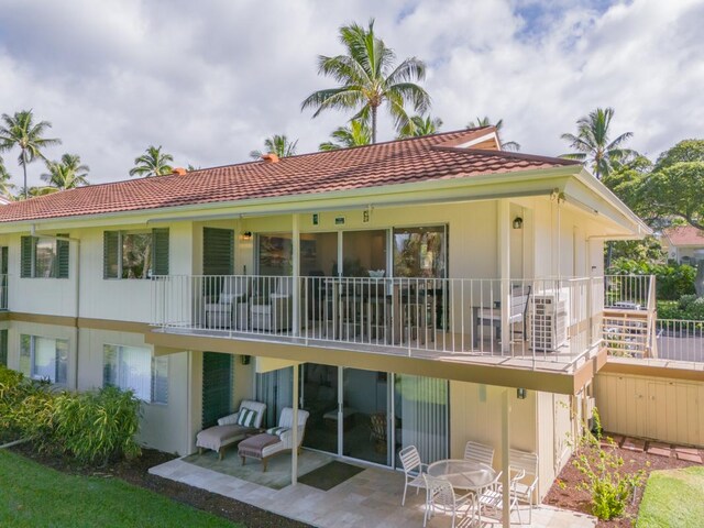 78-7054 Kamehameha Iii Rd Unit 803, Kailua-Kona, HI 96740 - rear view of property featuring a tile roof, a patio, and stucco siding