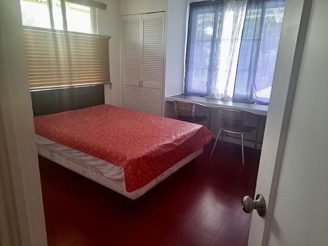 74 Maikai St, Hilo, HI 96720 - bedroom with dark wood-type flooring, a closet, and an office area