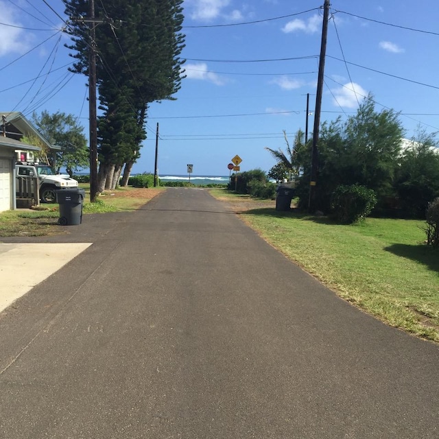 4463 Makaha Rd, Kapaa, HI 96746 - view of asphalt road featuring traffic signs
