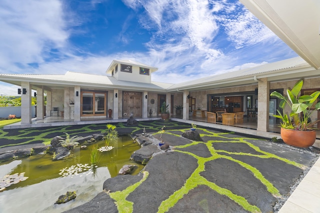 17-250 Meaulu St, Keaau, HI 96749 - view of front of property with a garden pond and french doors