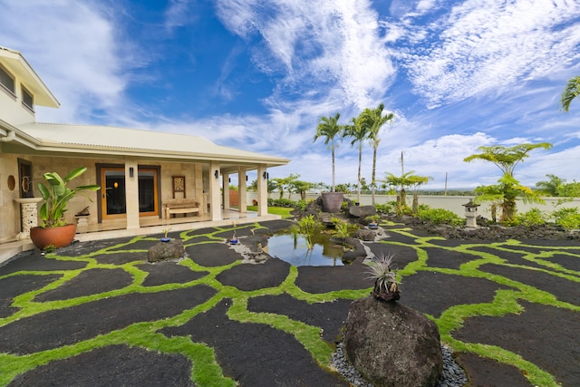 17-250 Meaulu St, Keaau, HI 96749 - view of yard with covered porch and a garden pond