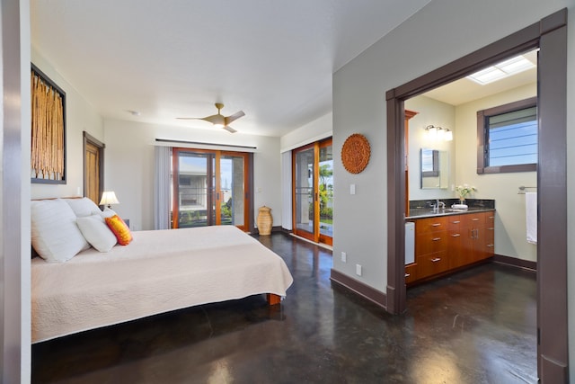 17-250 Meaulu St, Keaau, HI 96749 - bedroom featuring finished concrete floors, a sink, access to outside, baseboards, and ensuite bath