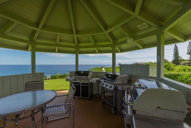 3811 Edward Rd Unit 8204, Princeville, HI 96722 - view of patio with a water view and a grill