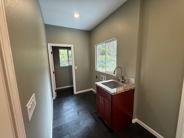 11-3782-A Nahelenani St, Volcano, HI 96785 - laundry area with hookup for an electric dryer, baseboards, dark stone finish floors, and hookup for a washing machine