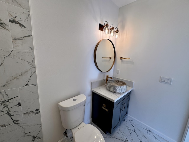 11-3782-A Nahelenani St, Volcano, HI 96785 - bathroom featuring marble look tile flooring, vanity, toilet, and baseboards