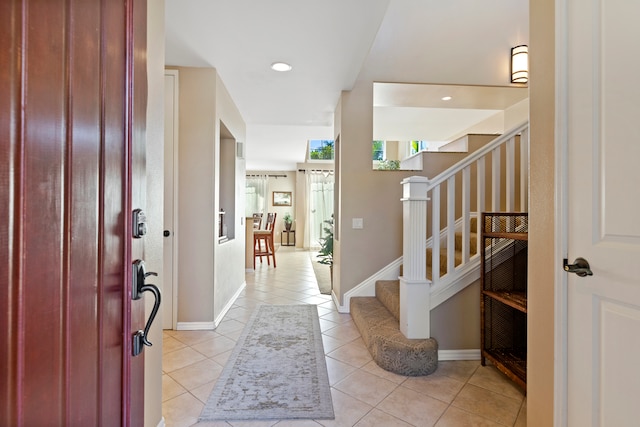 69-200 Pohakulana Pl Unit L1, Waikoloa, HI 96738 - entrance foyer with light tile patterned floors, stairs, baseboards, and recessed lighting