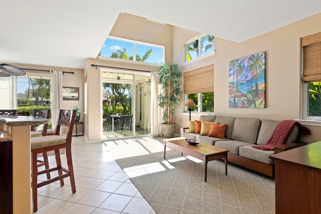 69-200 Pohakulana Pl Unit L1, Waikoloa, HI 96738 - living area featuring light tile patterned flooring, healthy amount of natural light, and a towering ceiling