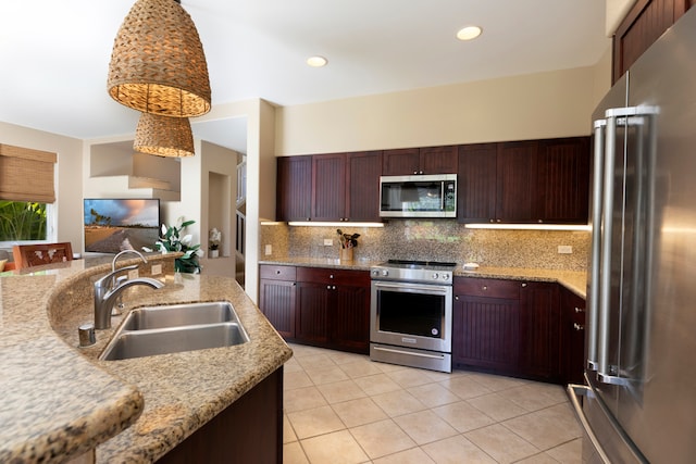 69-200 Pohakulana Pl Unit L1, Waikoloa, HI 96738 - kitchen with appliances with stainless steel finishes, a sink, light tile patterned floors, tasteful backsplash, and light stone countertops