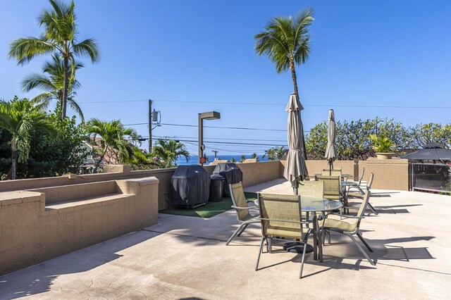 75-5865 Walua Rd Unit E631, Kailua-Kona, HI 96740 - view of patio featuring outdoor dining area and a grill