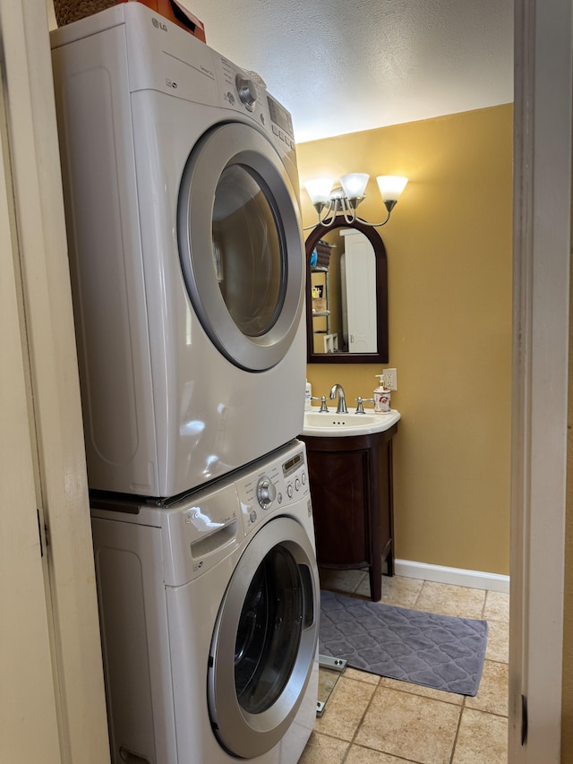 68-3744 Ua Noe Pl, Waikoloa, HI 96738 - washroom featuring estacked washer and dryer, a chandelier, and baseboards
