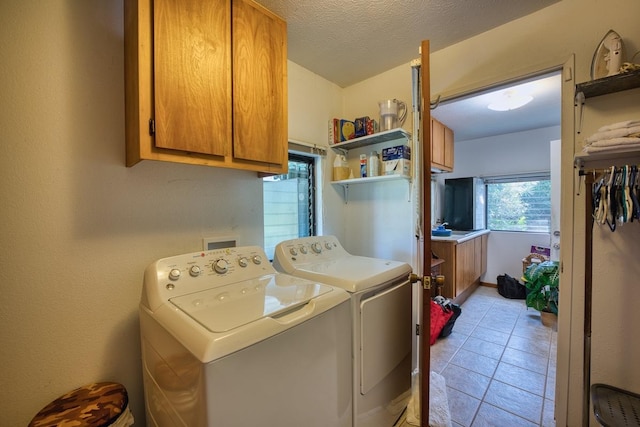 15-1429 23rd Ave, Keaau, HI 96749 - washroom featuring cabinet space, washer and clothes dryer, light tile patterned flooring, and a textured ceiling