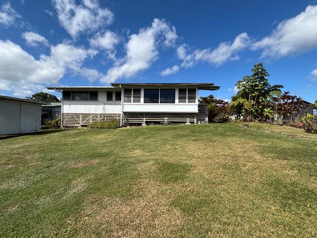 273 Iwalani St, Hilo, HI 96720 - back of property with a yard and a sunroom