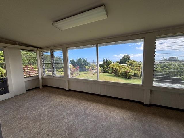 273 Iwalani St, Hilo, HI 96720 - unfurnished sunroom featuring plenty of natural light, carpet, and lofted ceiling