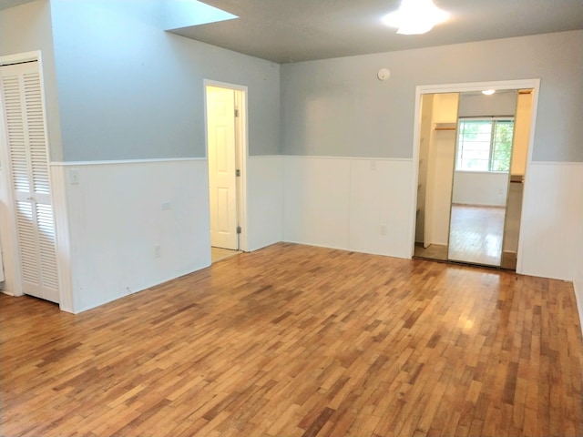 13-1128 Malama St, Pahoa, HI 96778 - spare room with wainscoting and wood finished floors