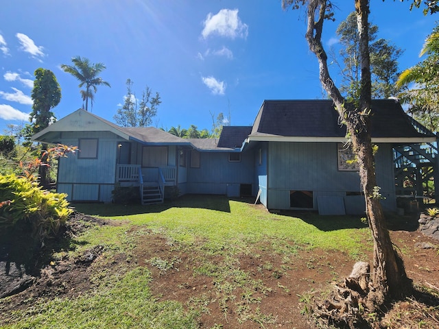 13-1128 Malama St, Pahoa, HI 96778 - rear view of house with a yard