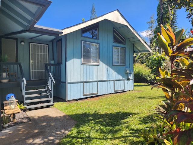 13-1128 Malama St, Pahoa, HI 96778 - view of home's exterior featuring a yard